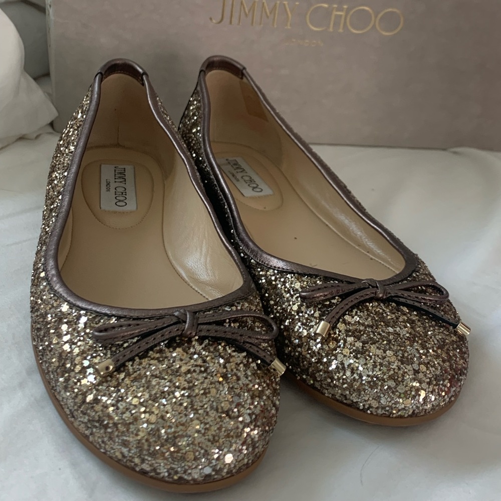 Jimmy Choo flats. Worn once. Comes with box and dust bag